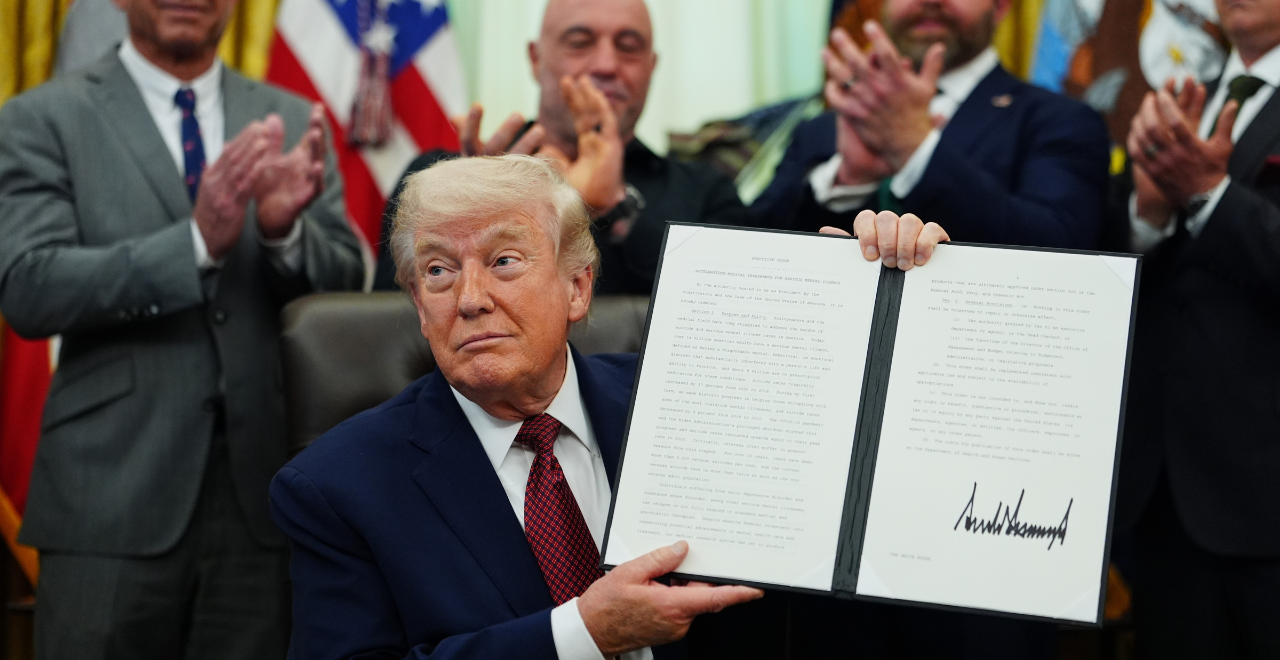 Trump showing signed executive order with Joe Rogan and others in the background, to fast-track psychedlics by giving $50 million to FDA for making ibogaine, psilocybin and other psychedelics available.